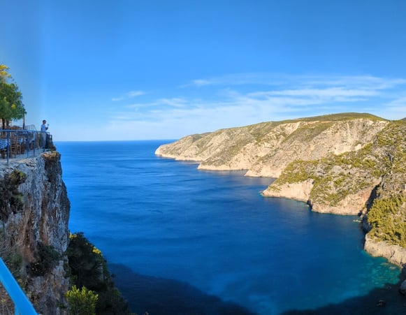 A sea view in Greece with rocky landscape surrounding it