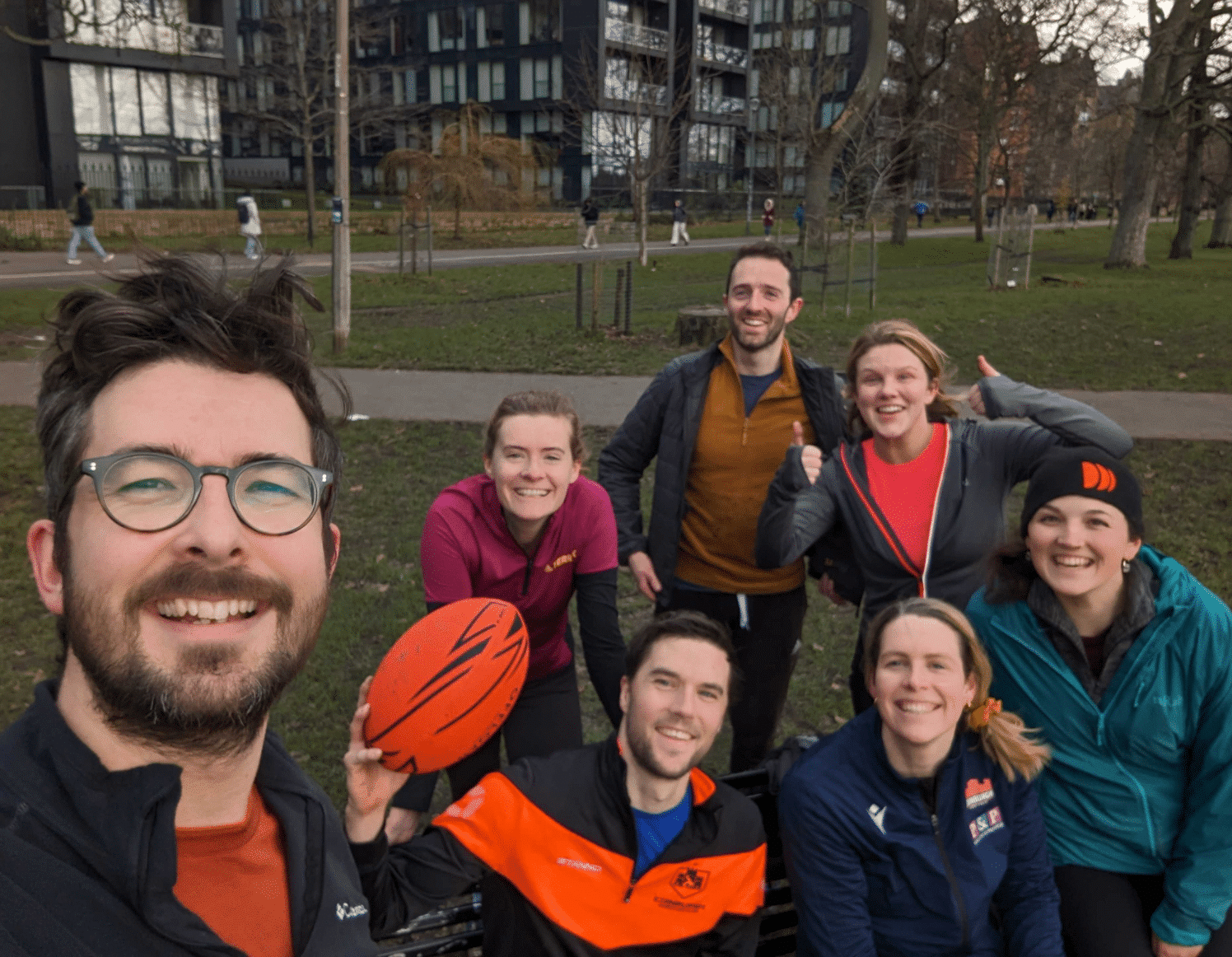 Dayshape touch rugby players pose for a photo in the park before training