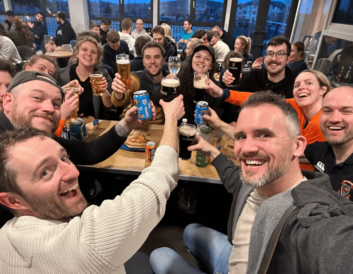 Dayshape touch rugby players celebrate with a drink after the tournament